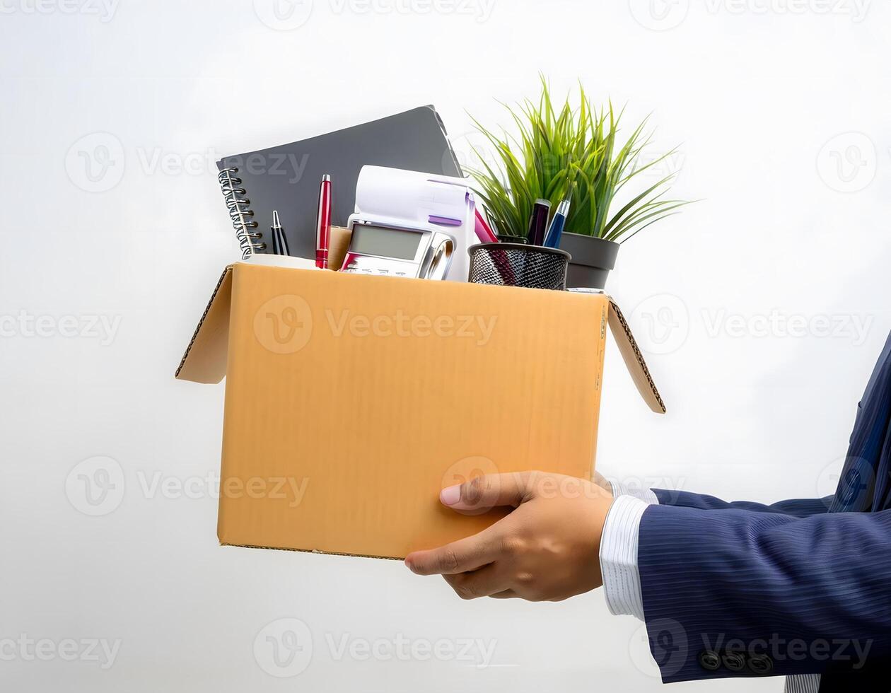 Businessman's Hand Holding a Box of Personal Items and Letters, Isolated on White photo