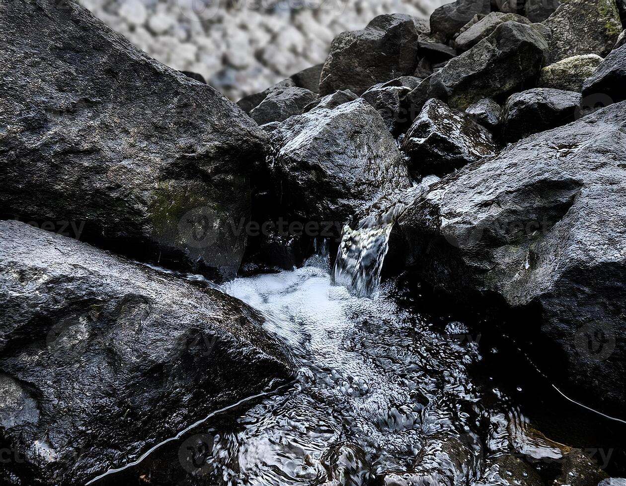Pristine Stream Gently Flowing Through Deep Black Stones photo