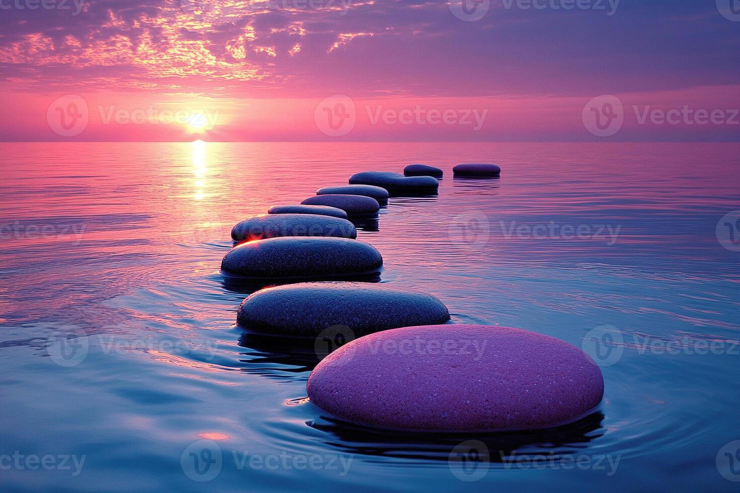 Large smooth stones lie in the sea at sunset, creating a path. The concept of harmony and balance. photo