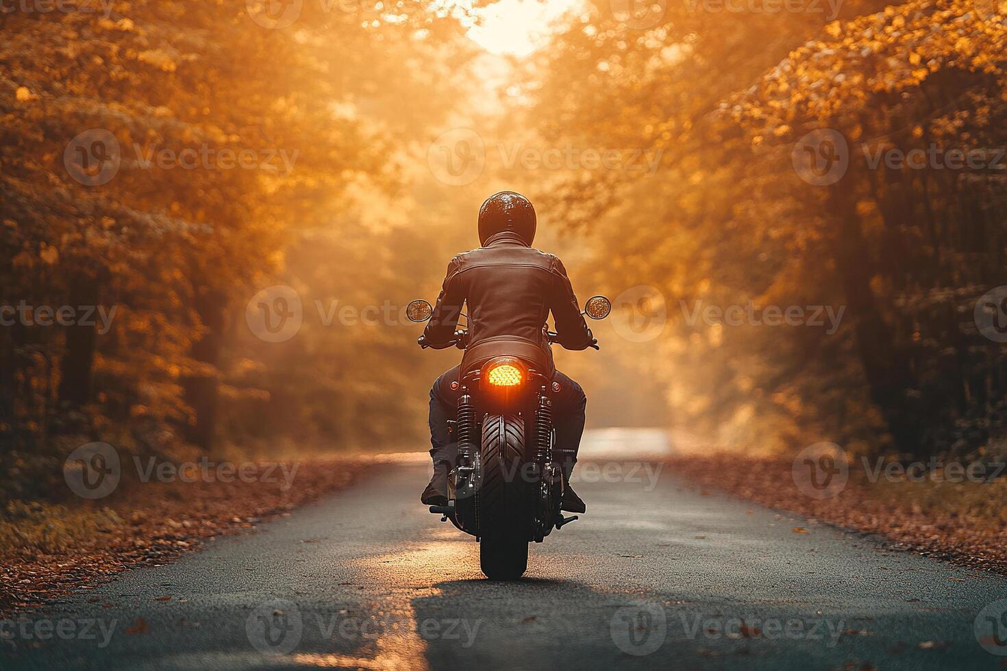 A motorcyclist rides a motorcycle on an asphalt road between the forest. Motorcycle on an empty road. Generated by artificial intelligence. photo