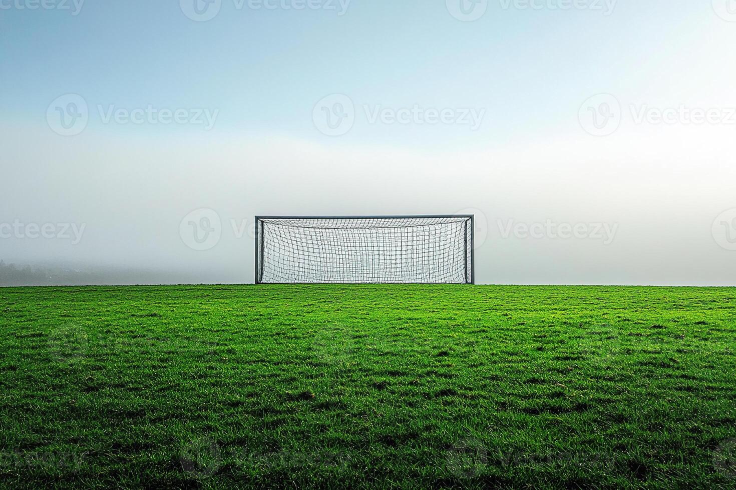 Football field, football goal,Football goals on green grass in a field on a very foggy morning. deflated ball and cloudy sky. Generated by artificial intelligence photo