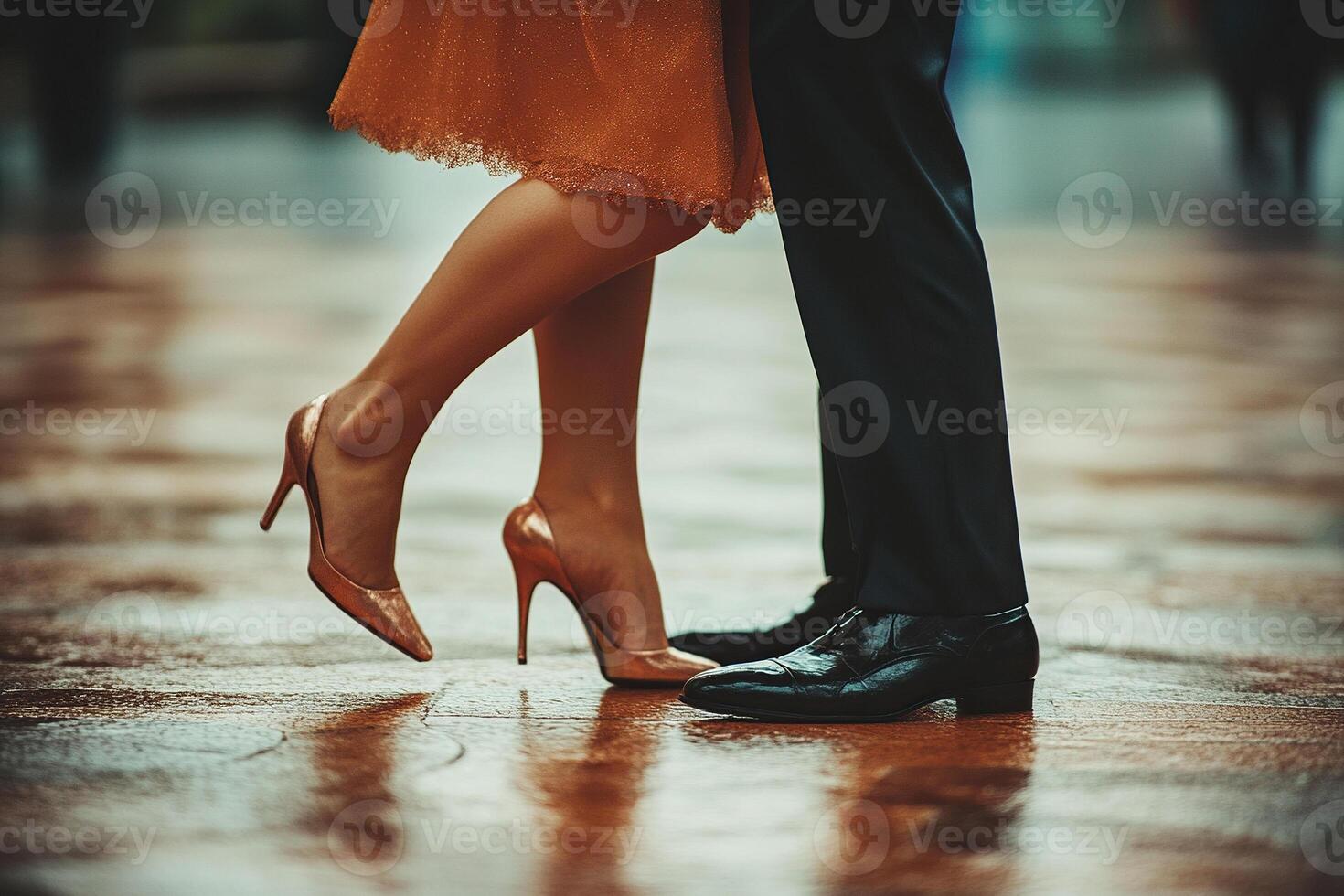 Dance shoes of a couple. A couple dancing a ballroom dance on wet asphalt. The dancers' feet are in close-up. A dance class photo
