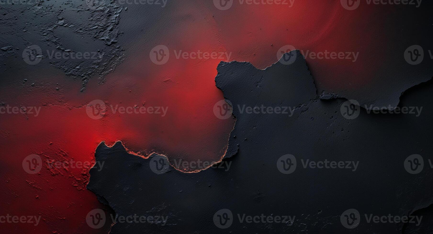 Subtle and evocative abstract backdrop created by red light blending into black on a textured surface photo