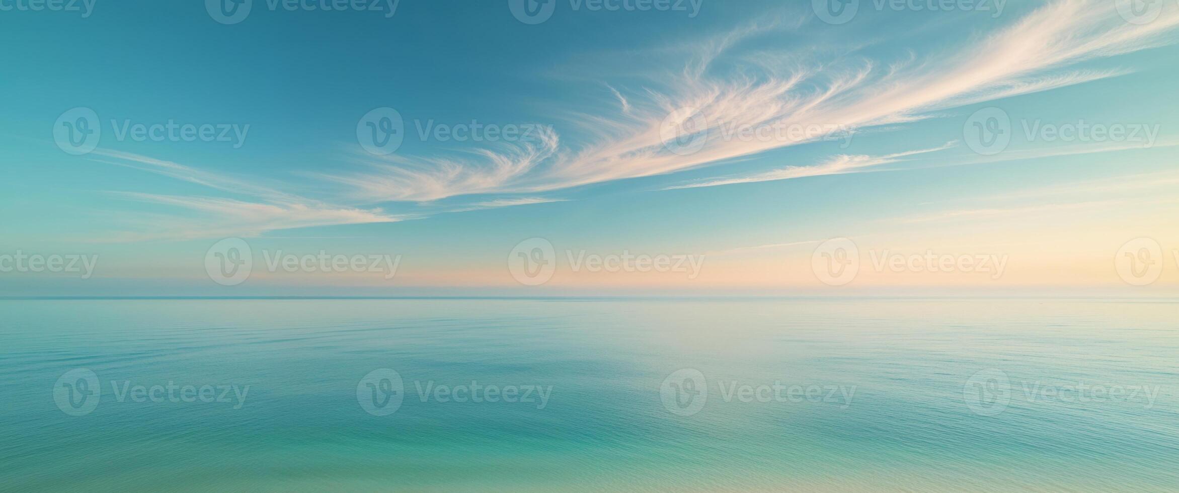 A beautiful blue sky with clouds over the ocean photo
