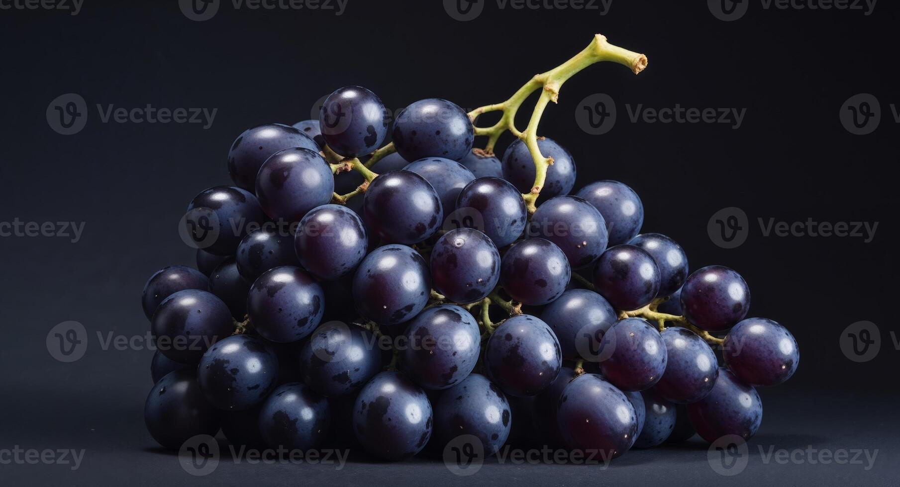A bunch of grapes on a black background photo