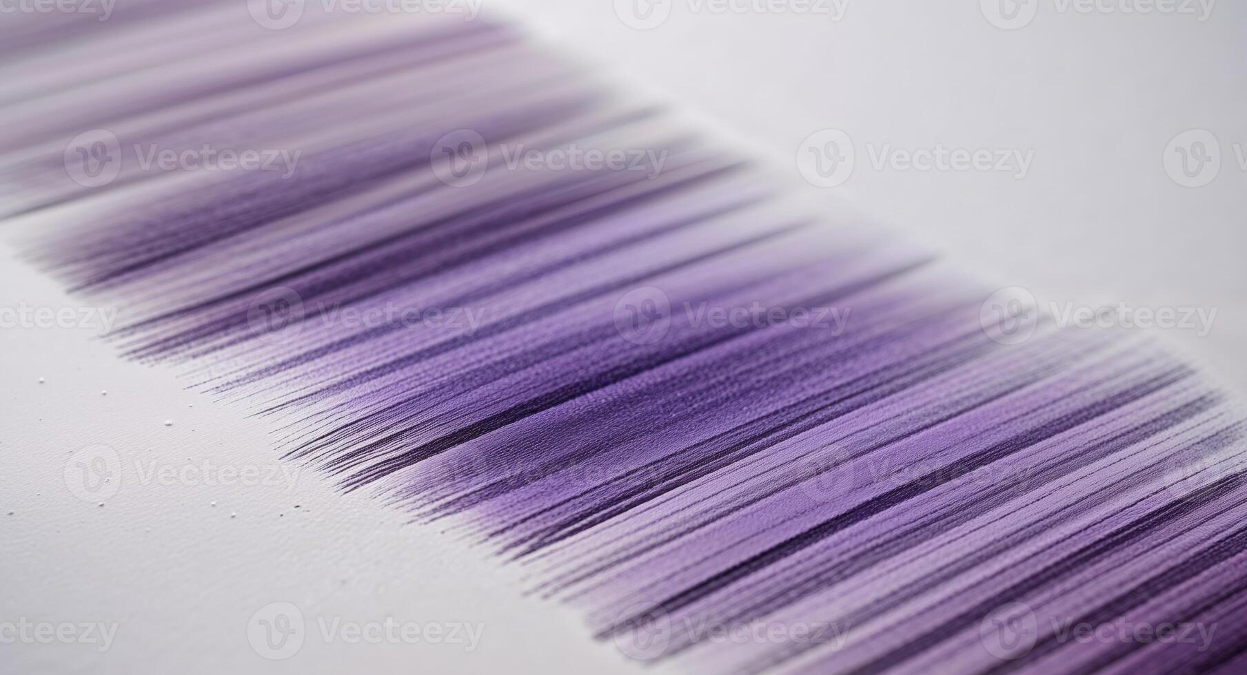 A close up of a purple and white striped brush photo