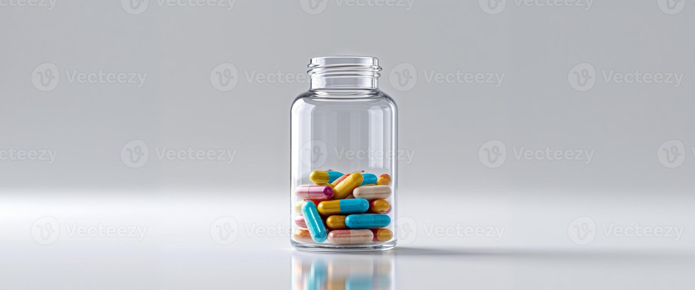 A bottle filled with pills on a table photo