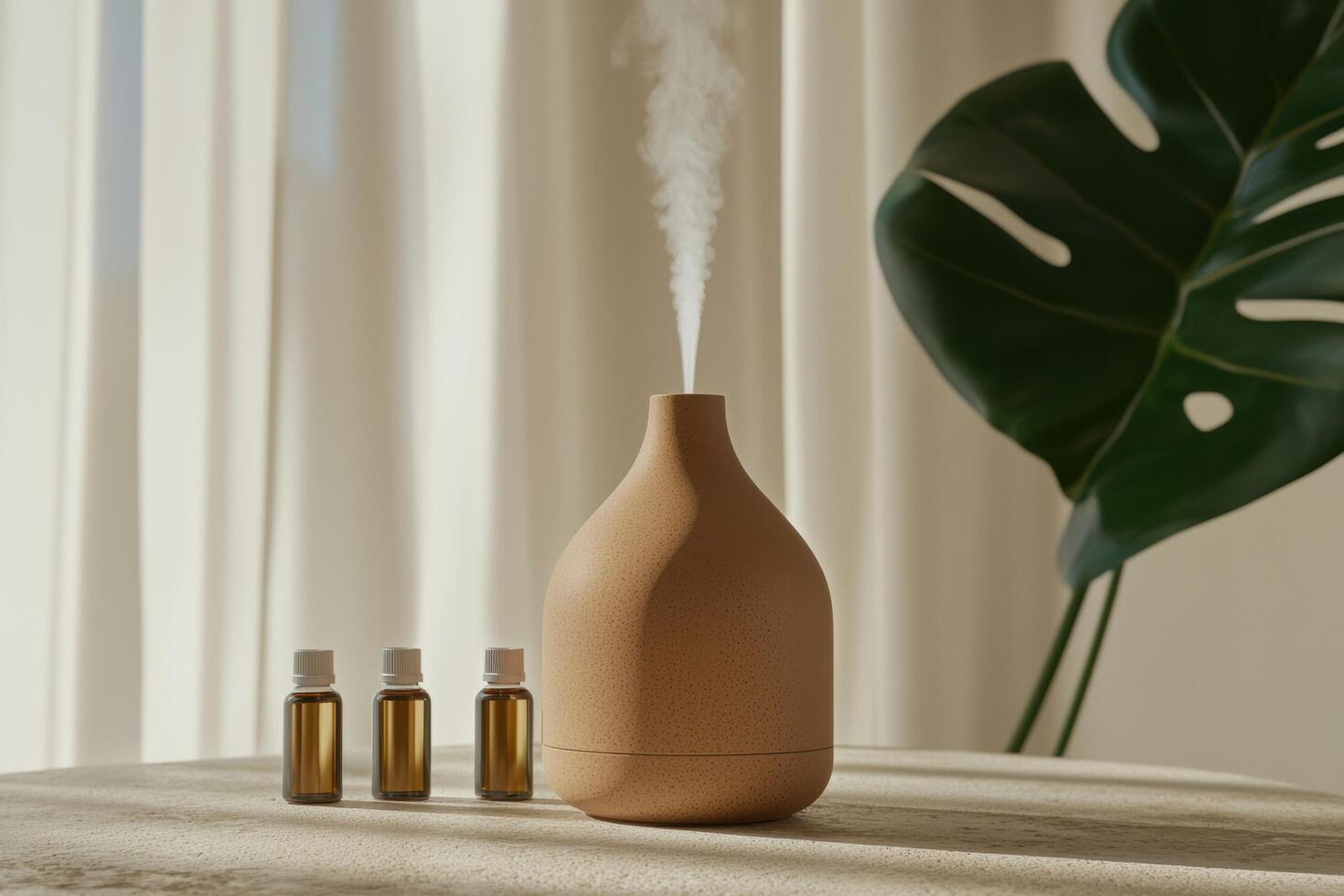 Aroma diffuser with essential oils and monstera plant for aromatherapy photo