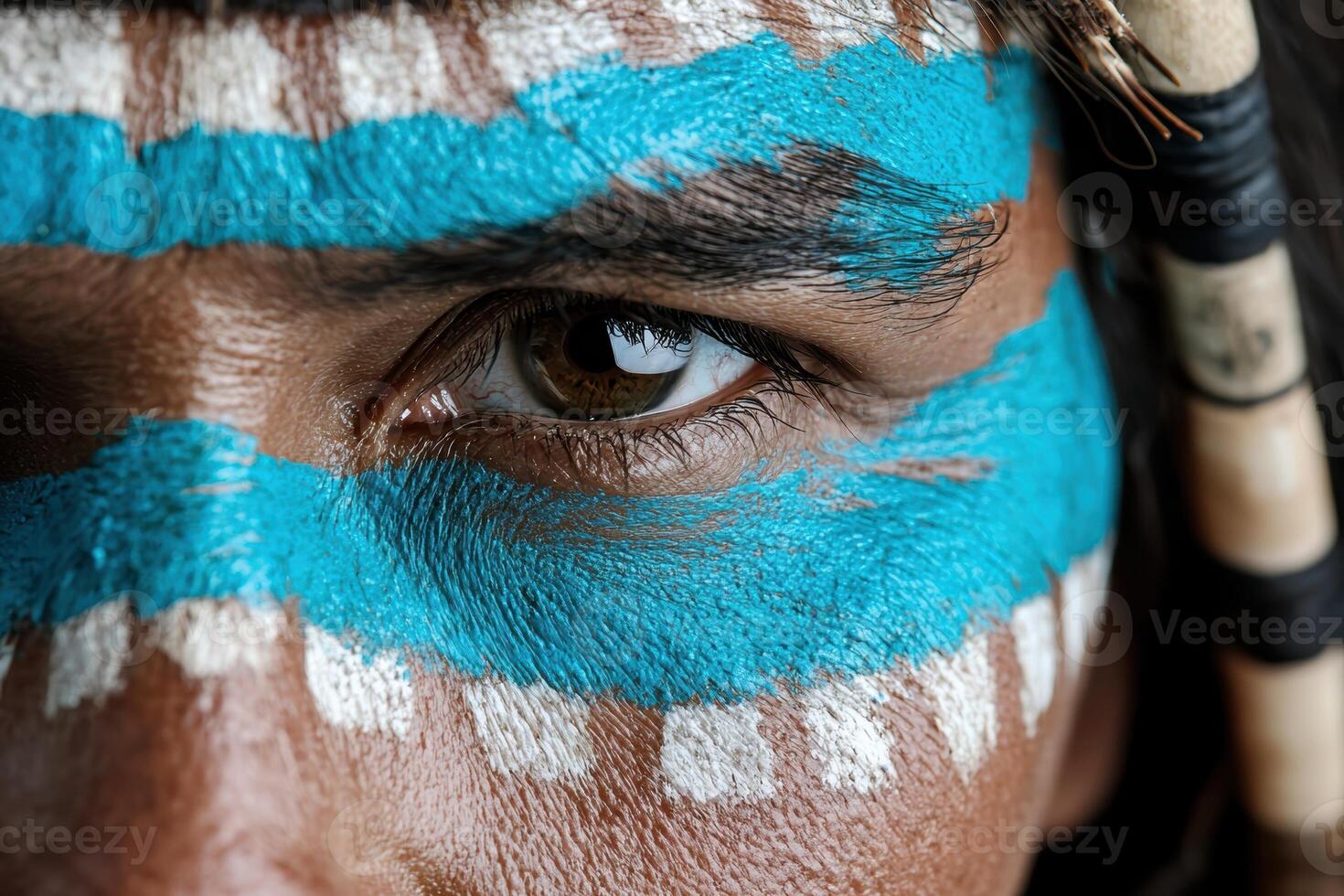 Close up of a persons face with blue and white face paint photo