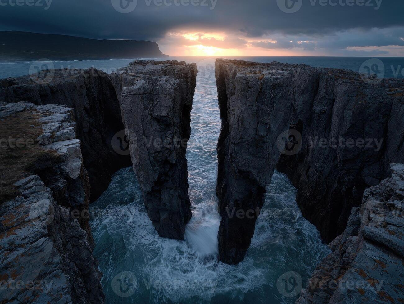 Dramatic coastal cliffs and ocean at sunset photo