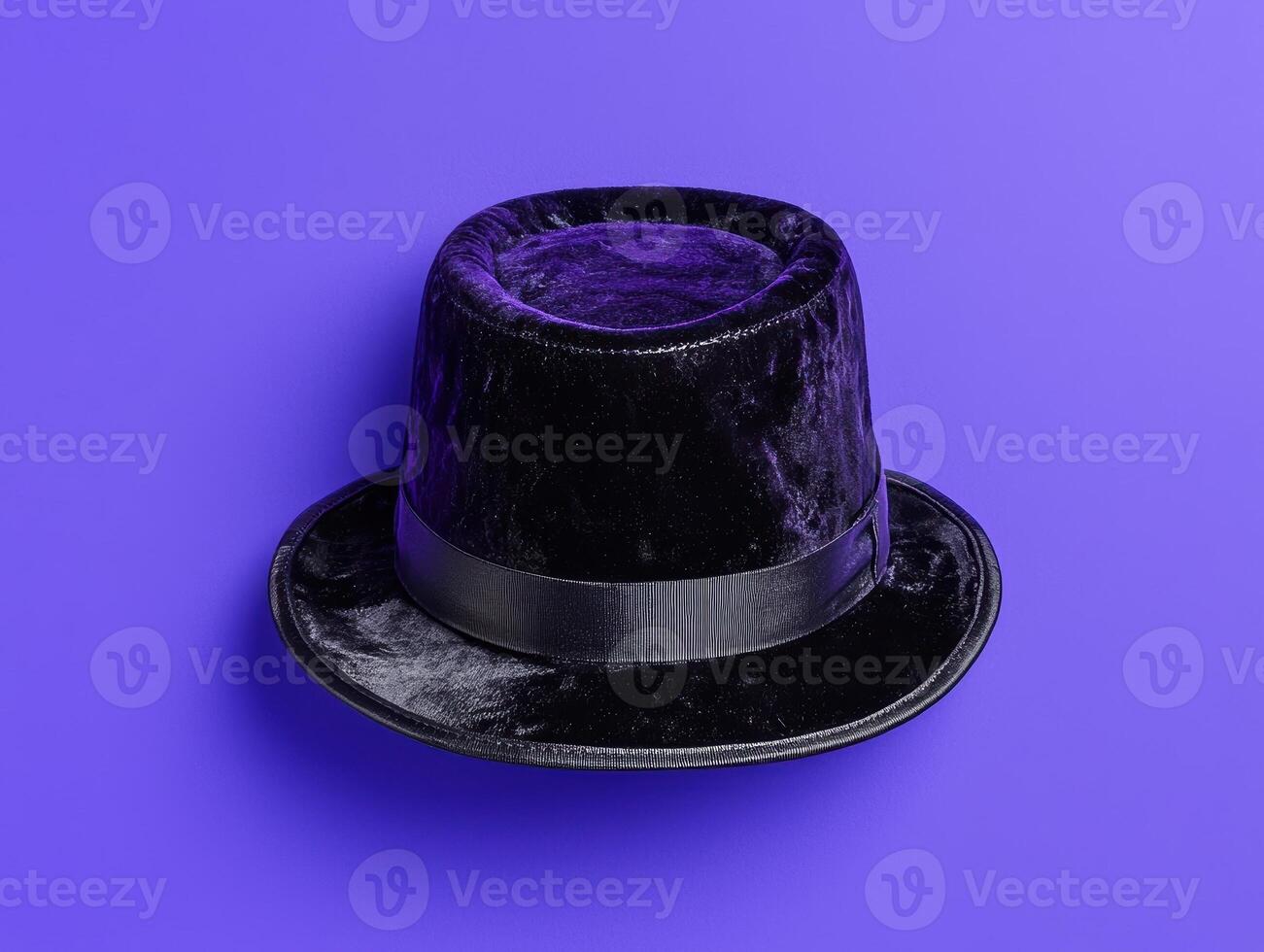 A black top hat on a purple background photo