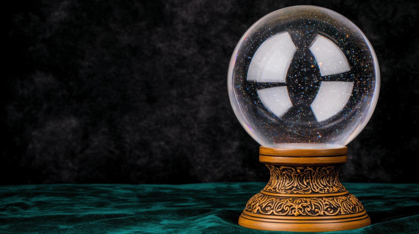 Crystal ball on a table with a dark background photo