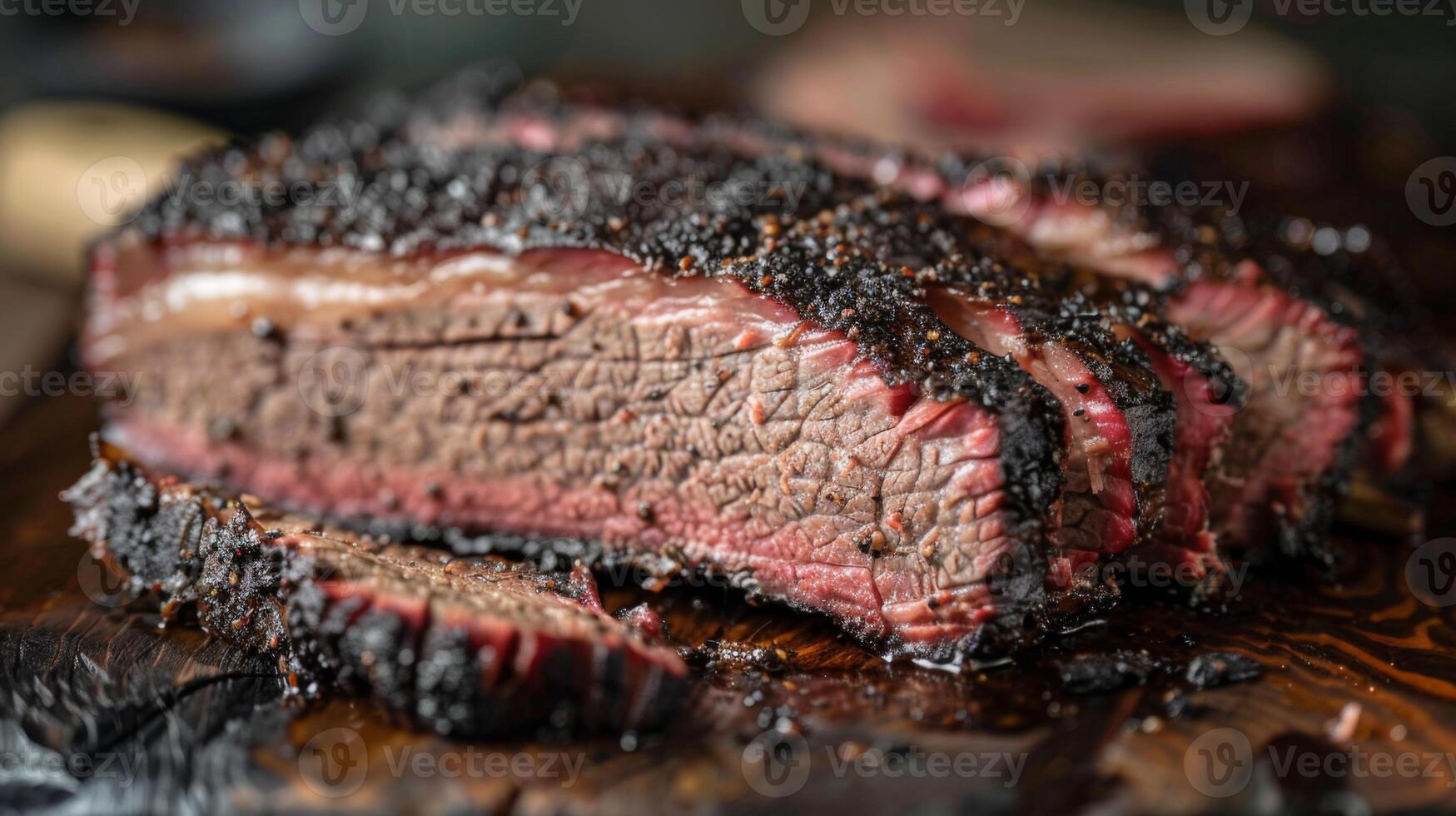 Mouthwatering smoked brisket rests on a wooden board, showcasing a deep crust and tender slices, ideal for summer barbecues. The inviting kitchen ambience adds to the culinary experience. photo