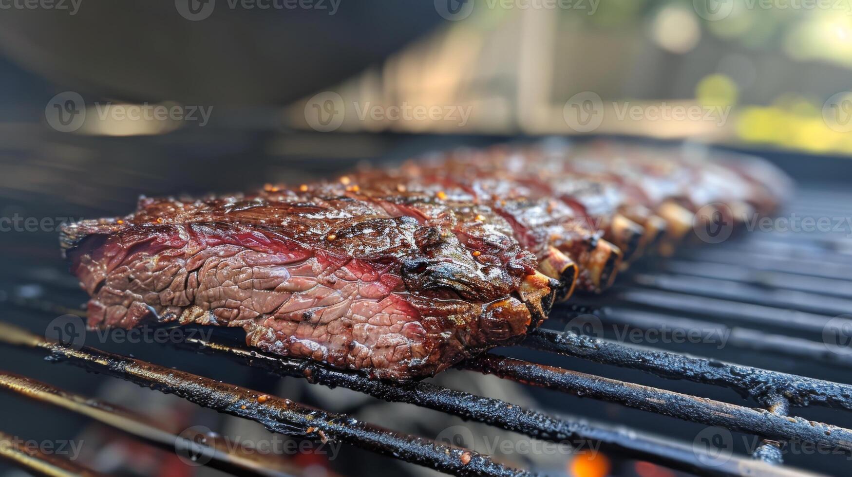 Juicy marinated steak is cooking on a barbecue grill in a backyard setting, with friends enjoying the sunny afternoon during a leisurely cookout. photo
