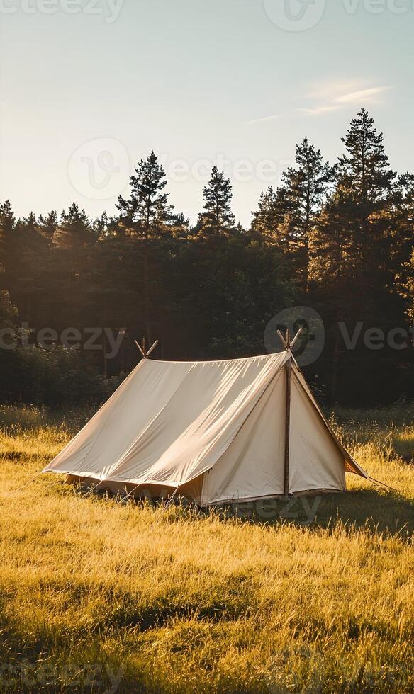 Serene Camping Experience, A Canvas Tent Nestled in a Golden Meadow Near a Forest photo