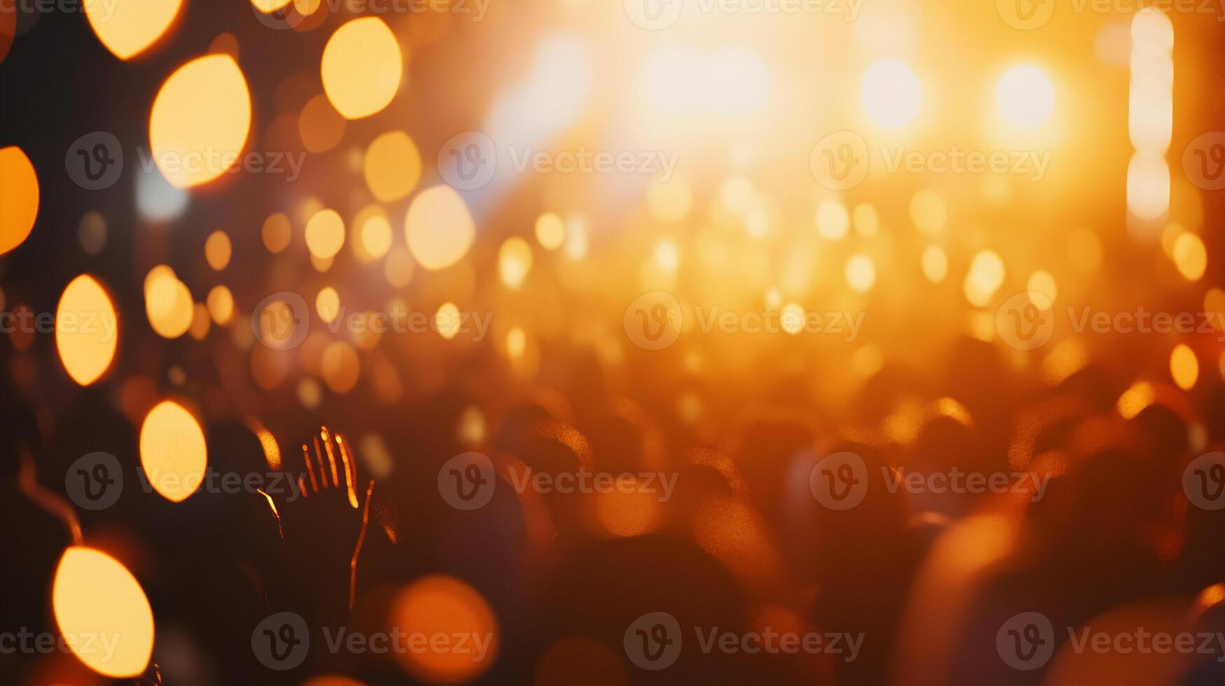 Energetic concert atmosphere with vibrant lights and enthusiastic crowd in blurred focus photo