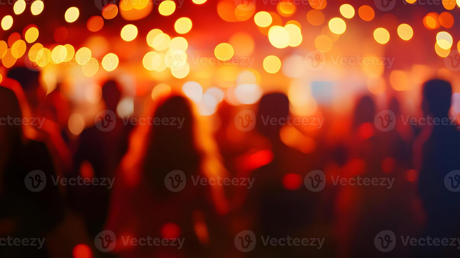 Blurred silhouettes enjoying a lively party atmosphere with vibrant lights overhead photo