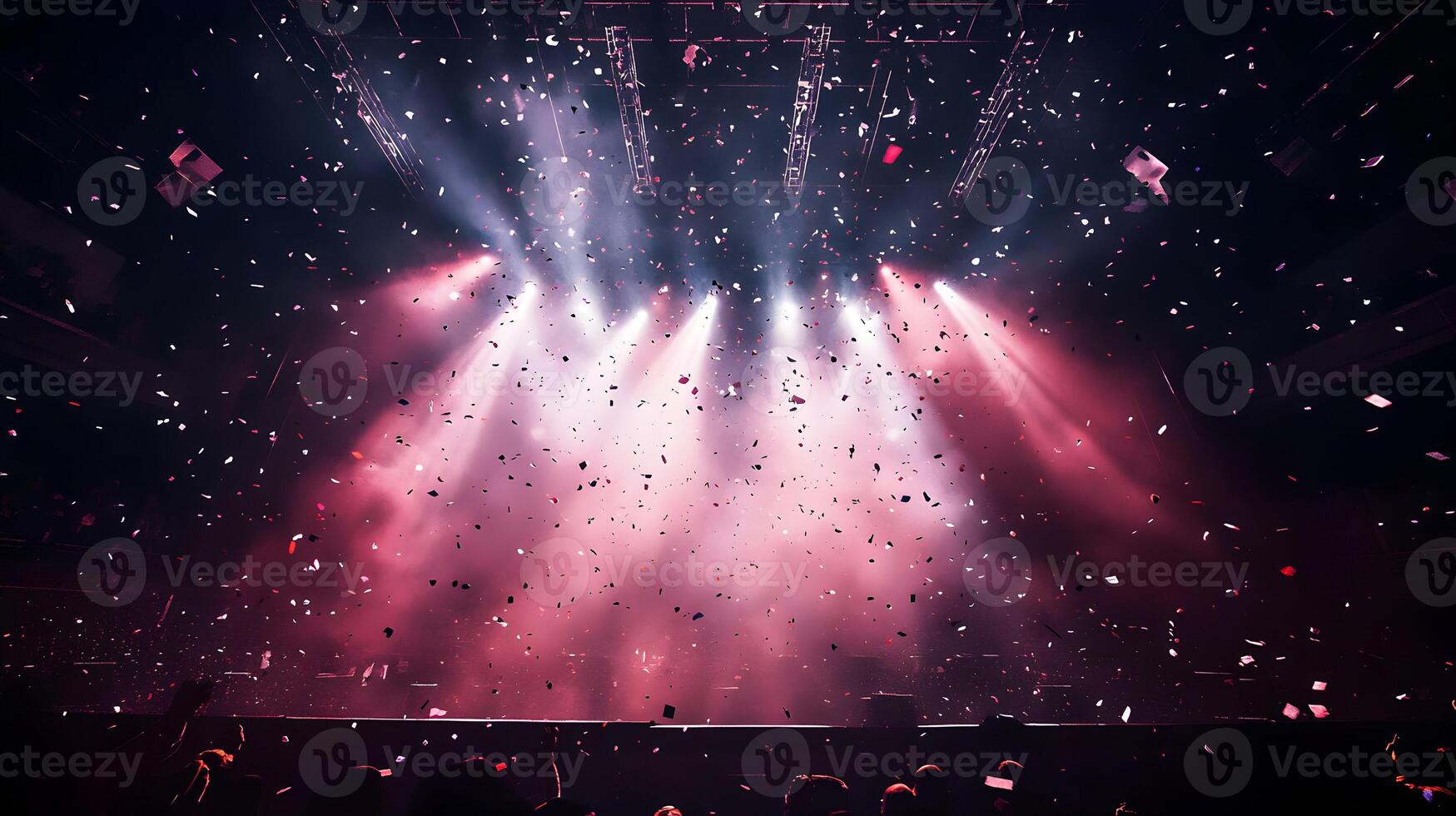 Captivating performance illuminated by mesmerizing lights and falling confetti during a concert photo