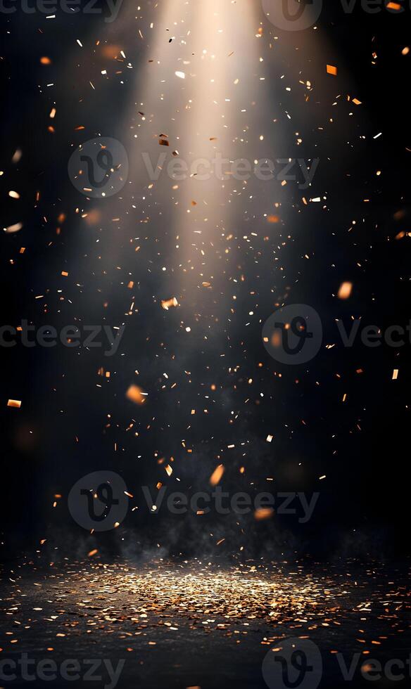 Golden confetti falling on a dark background with a spotlight shining down on celebration photo