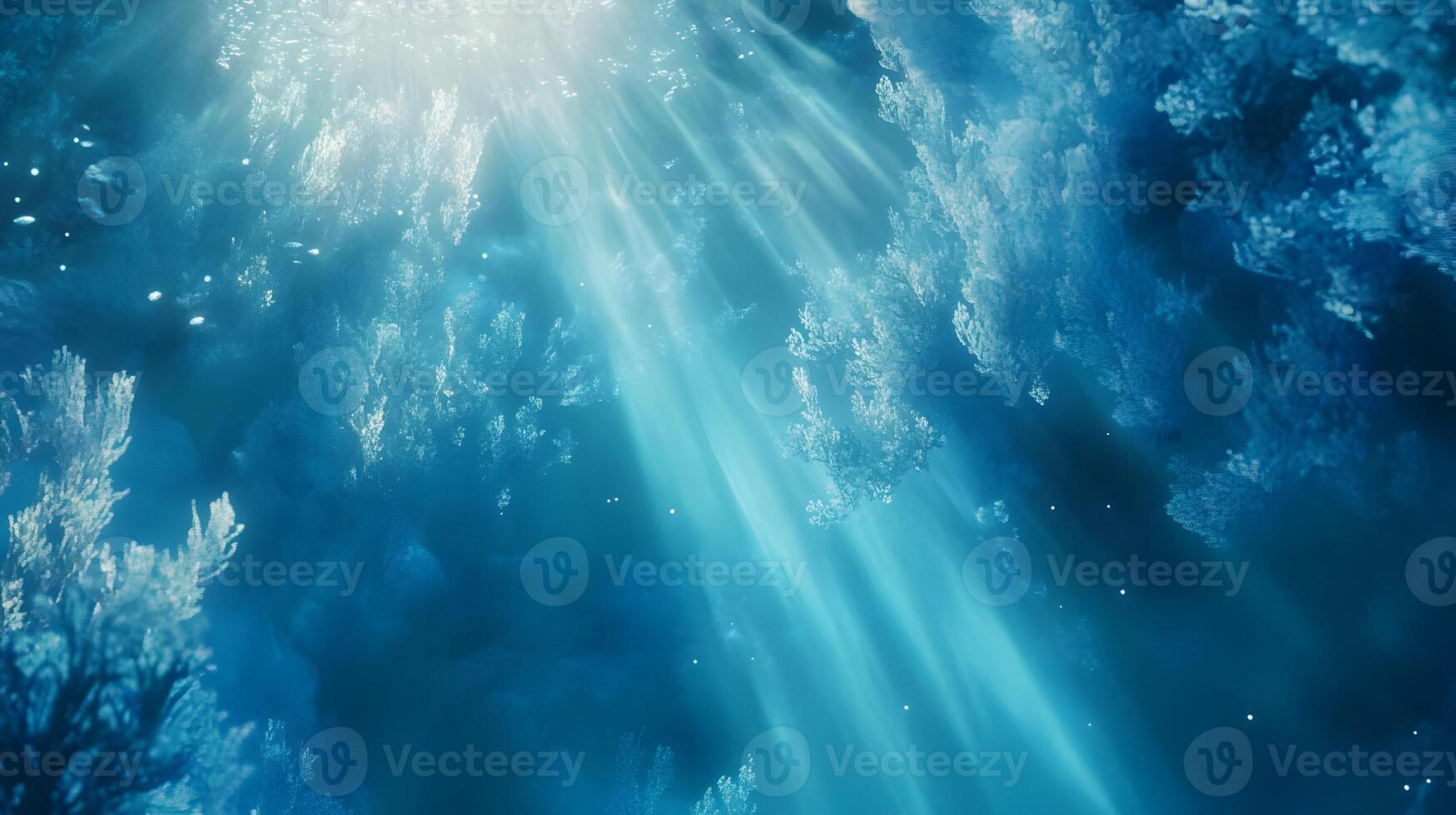 Abstract underwater with light rays shining through deep blue ocean water scene photo
