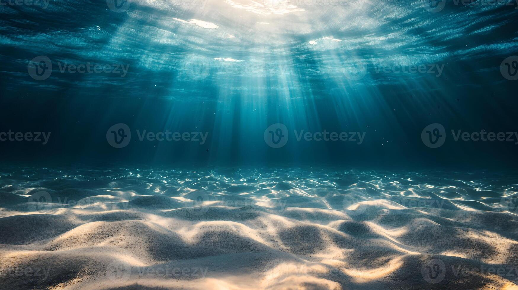 Underwater Sunlight Beams Illuminate Sandy Seabed Creating Serene and Peaceful Marine Scenery photo