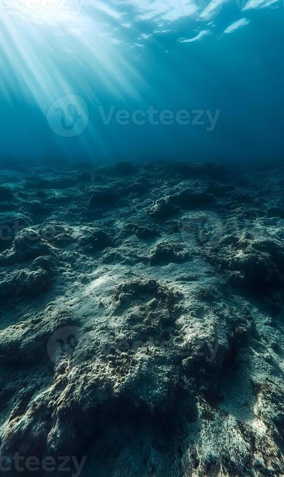 Underwater Sunlight Illuminates the Seabed in a Serene Deep Blue Ocean Scene photo