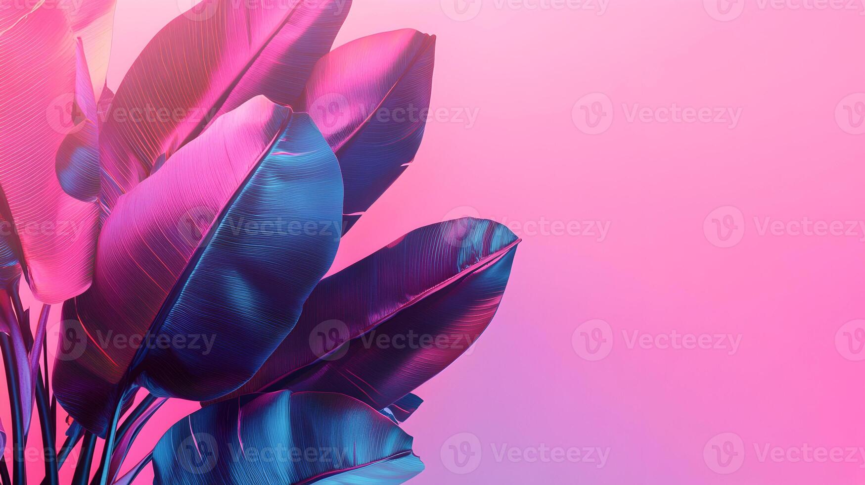 Exotic foliage in neon lights on a pink background adds an element of vibrant color photo