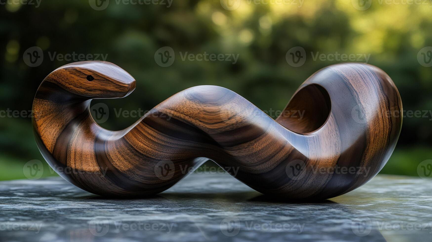 Wooden snake sculpture representing abstract concept resting on marble surface photo