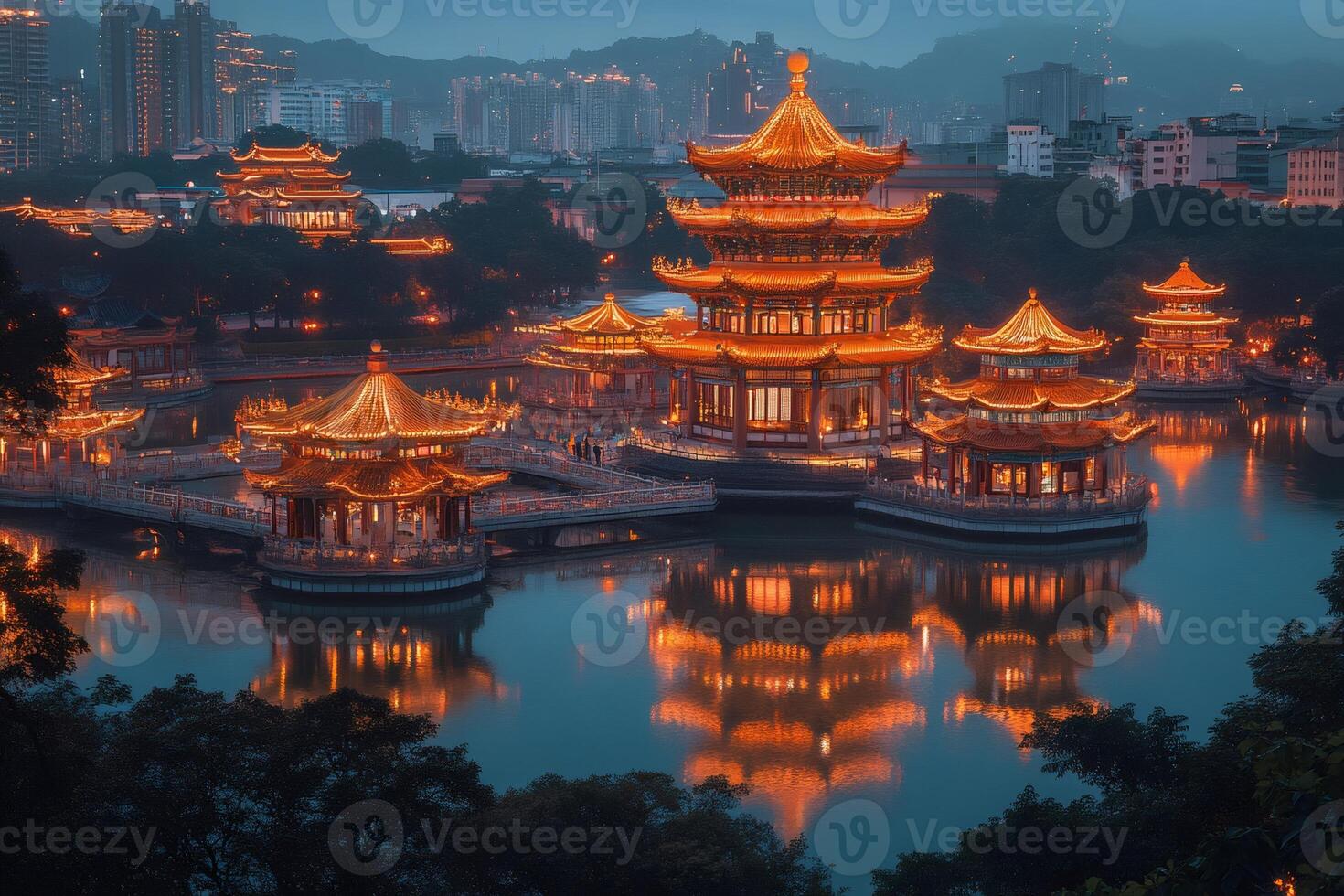 Traditional chinese pavilions reflecting on the lake at night in Nanhu Park, Guangxi, China photo