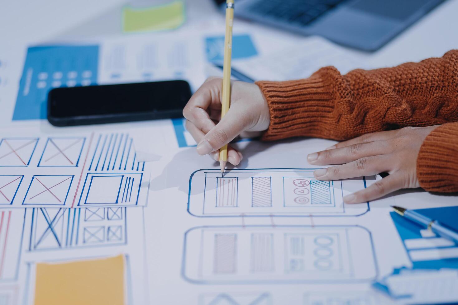 A person is working on a project with a pencil photo