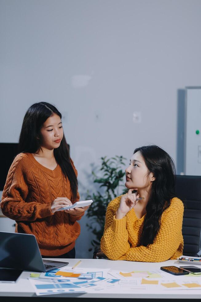 Two women talking in an office photo