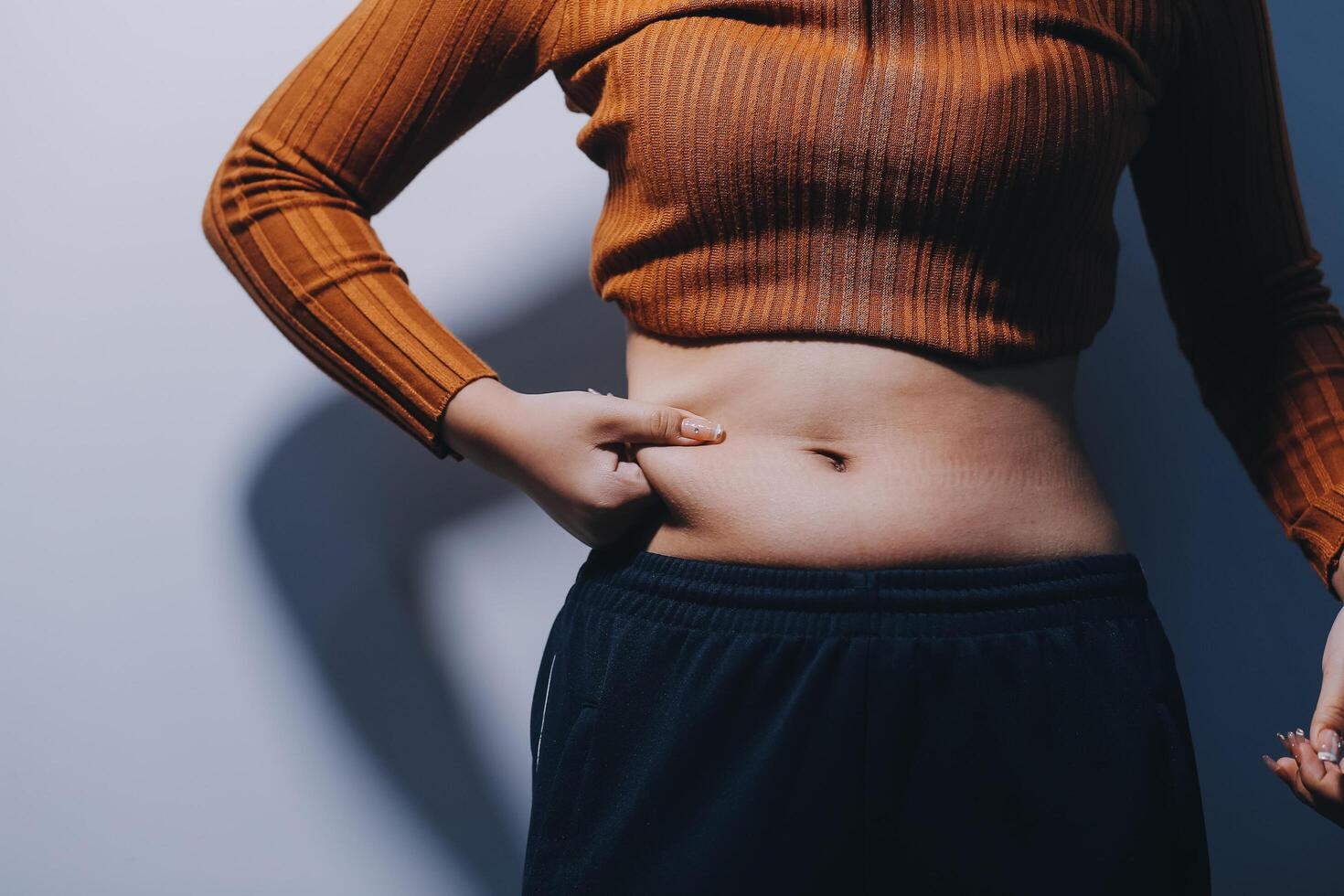 A woman with her stomach exposed photo