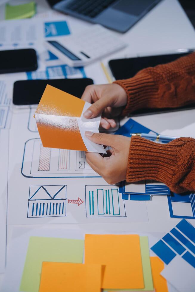 A person is working on a project with a piece of paper photo