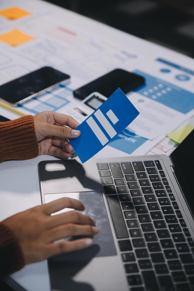 A person using a laptop with a facebook logo on it photo