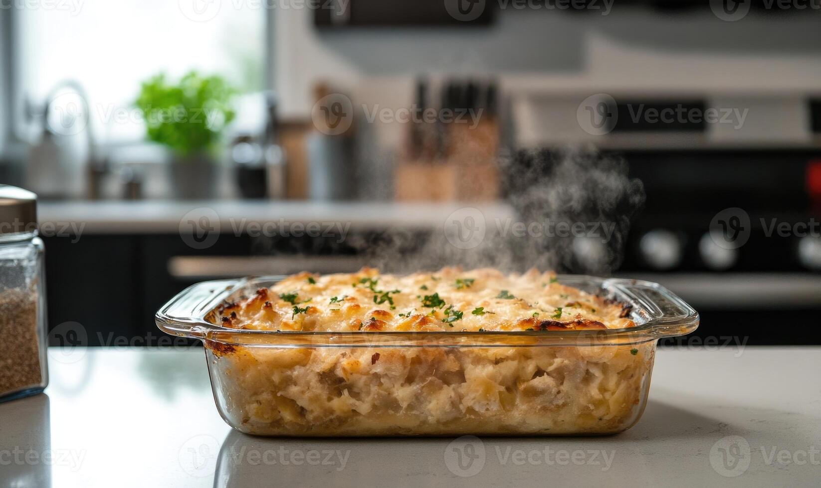 A glass dish with a white sauce and a lot of steam coming out of it photo
