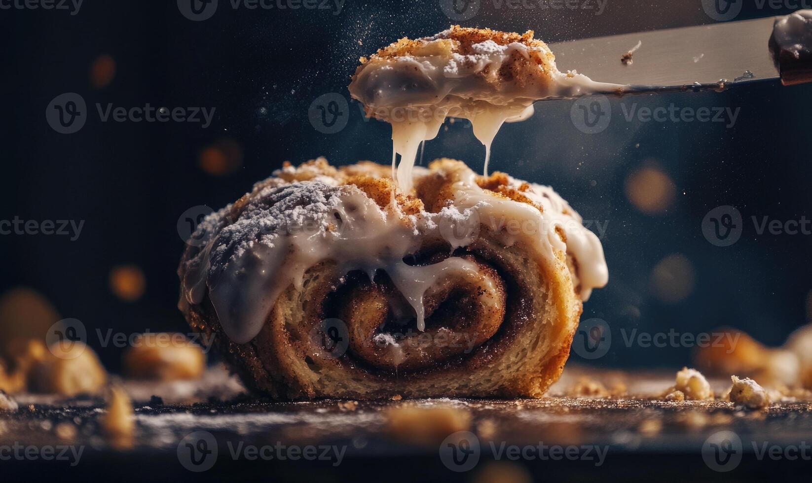 A piece of cinnamon roll with icing on it photo