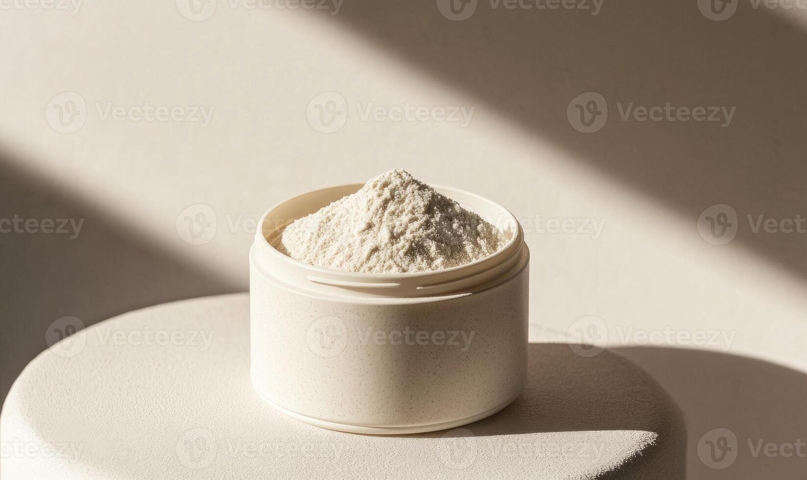 A white container with a white powder inside photo