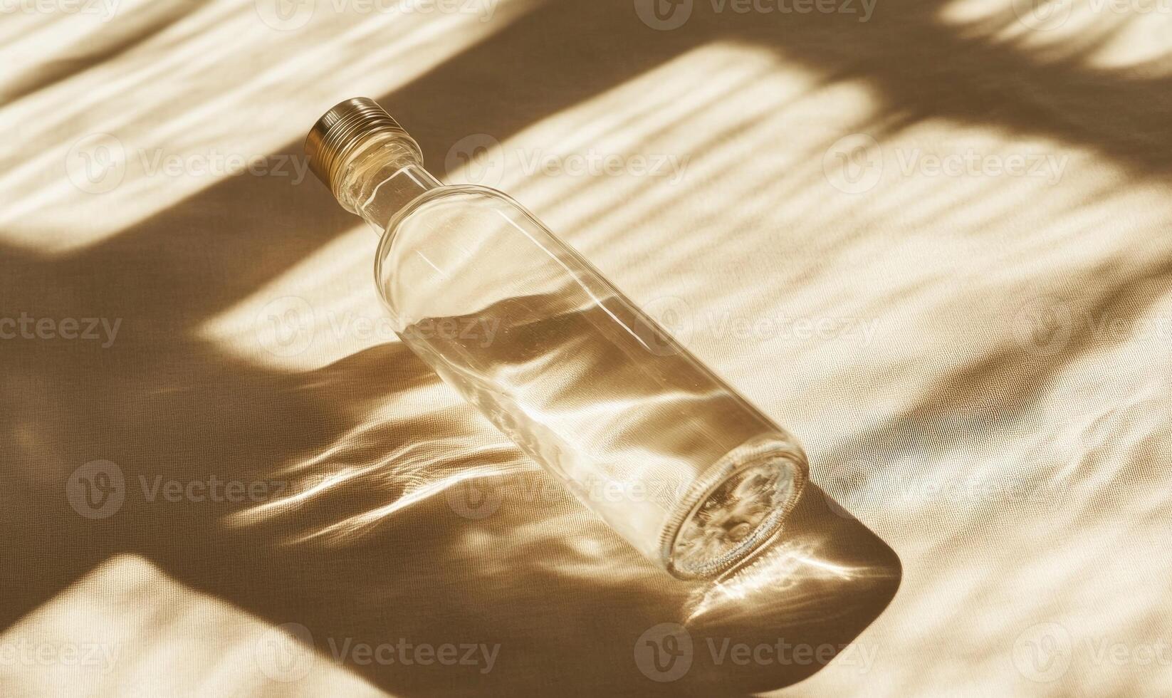 a bottle of water sitting on a table with shadows photo