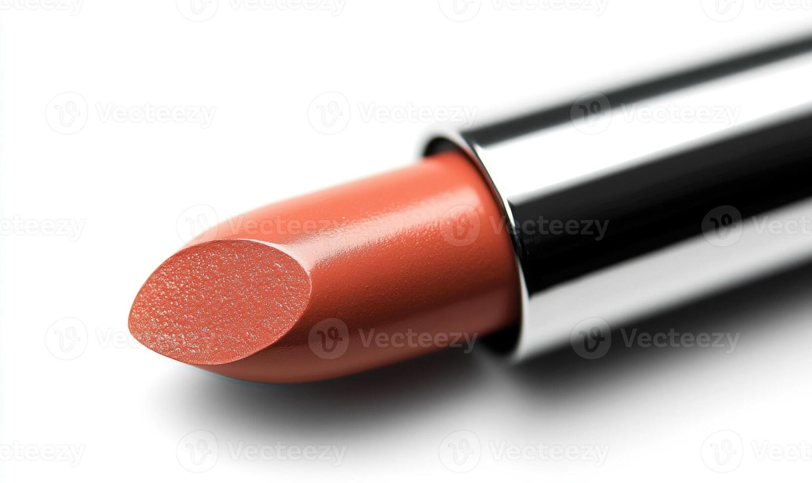 a close up of a lipstick on a white surface photo
