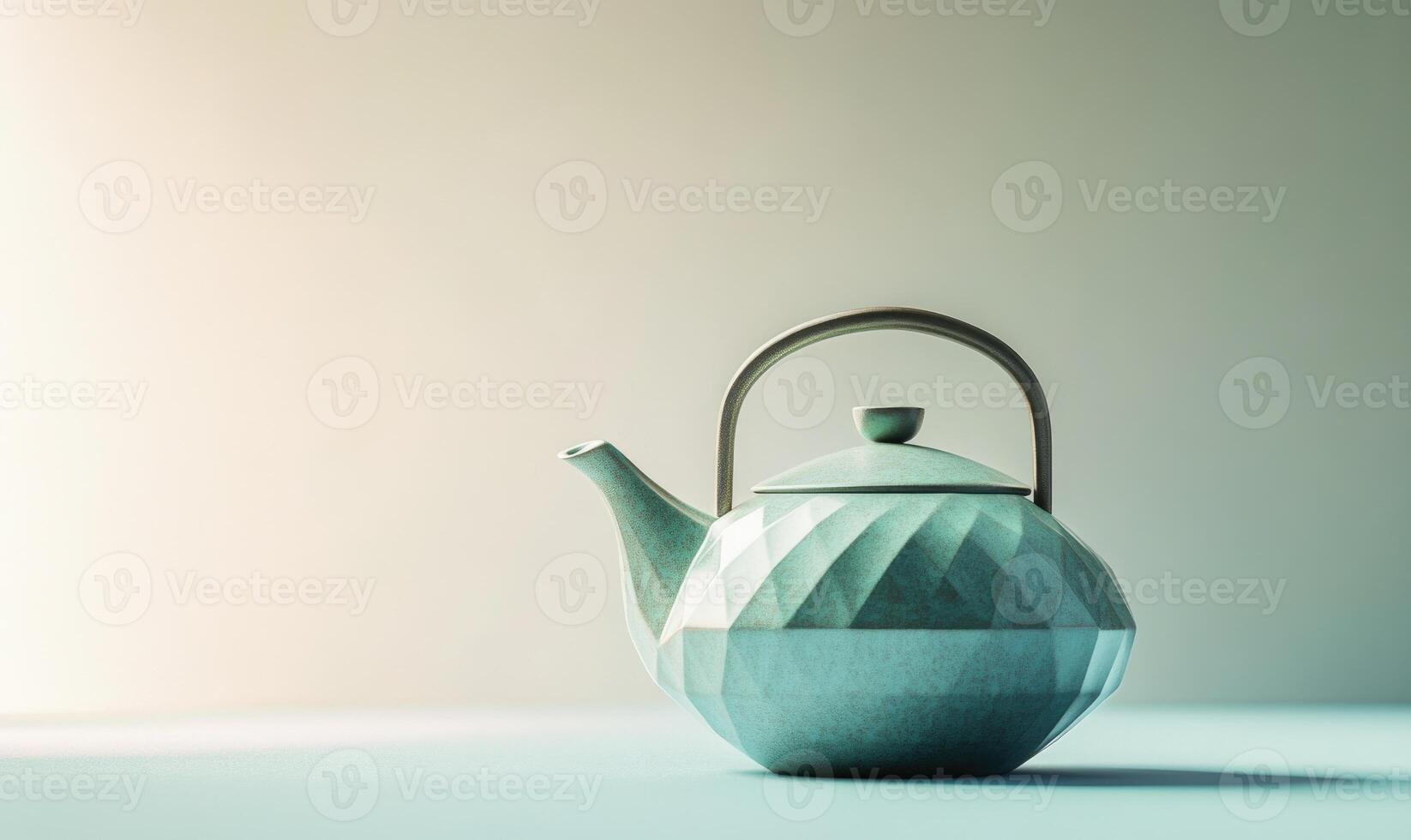 A blue teapot with a handle sits on a table photo