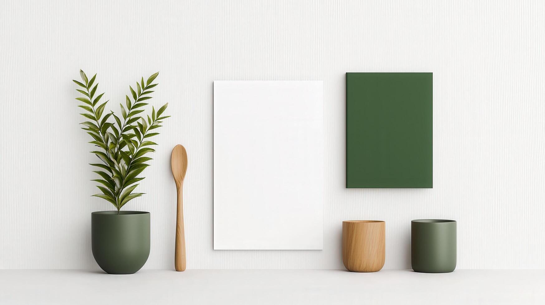 A white poster with a spoon on it sits on a table next to a green vase photo