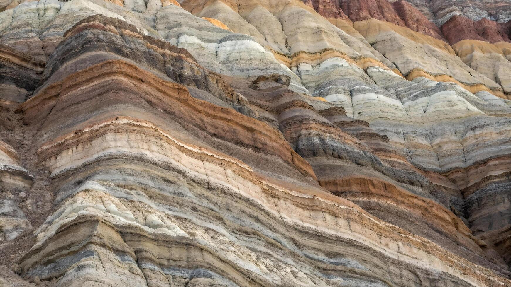 Natural Layered Rock Formation Close up Displaying Colorful Banded Sedimentary Strata and Textures photo