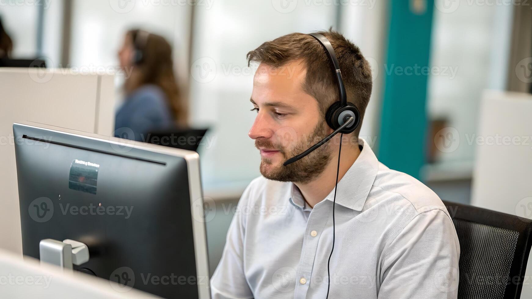 Focused Customer Service Representative Working at Computer photo