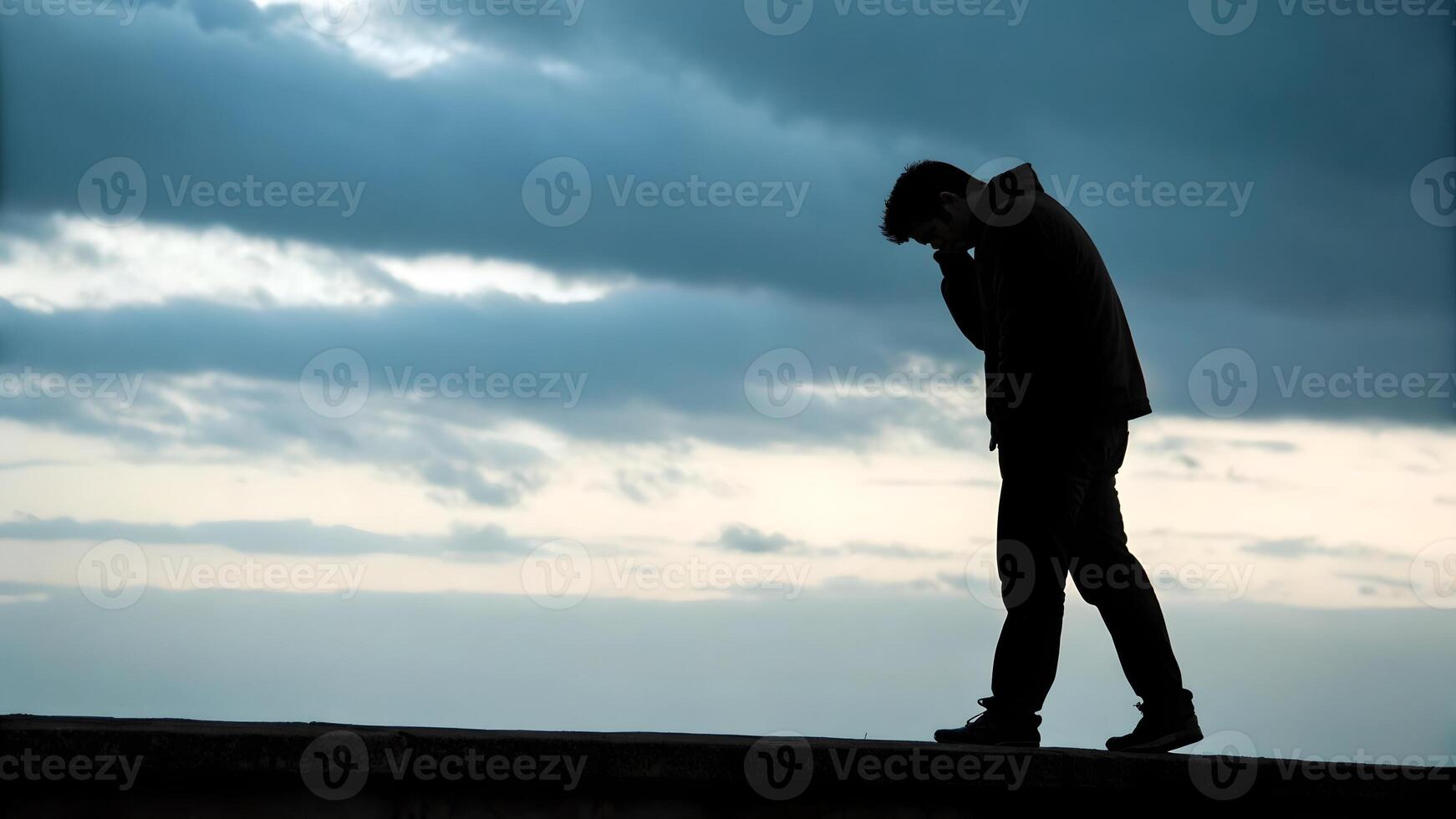 Solitary Figure Walking Under a Gloomy Sky photo