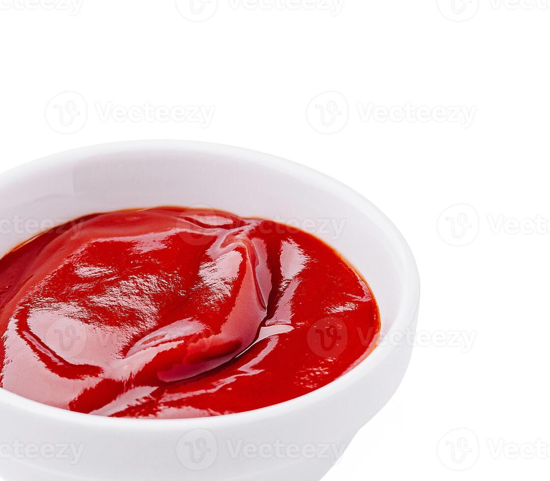 Red condiment in a white bowl perfect for dipping and seasoning photo