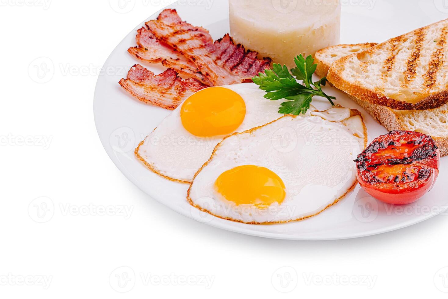 Delicious breakfast plate with eggs, bacon, and toast at a cafe photo