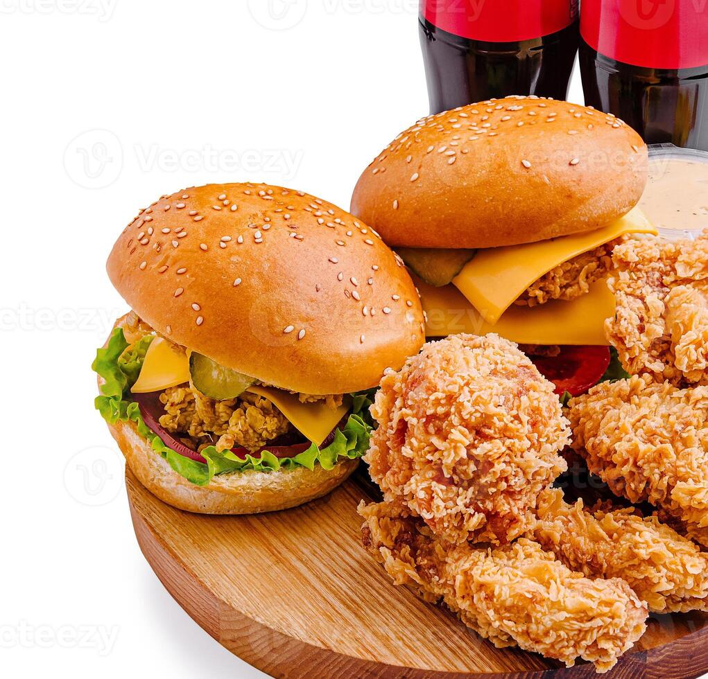 Delicious fast food spread with burgers and fried chicken photo