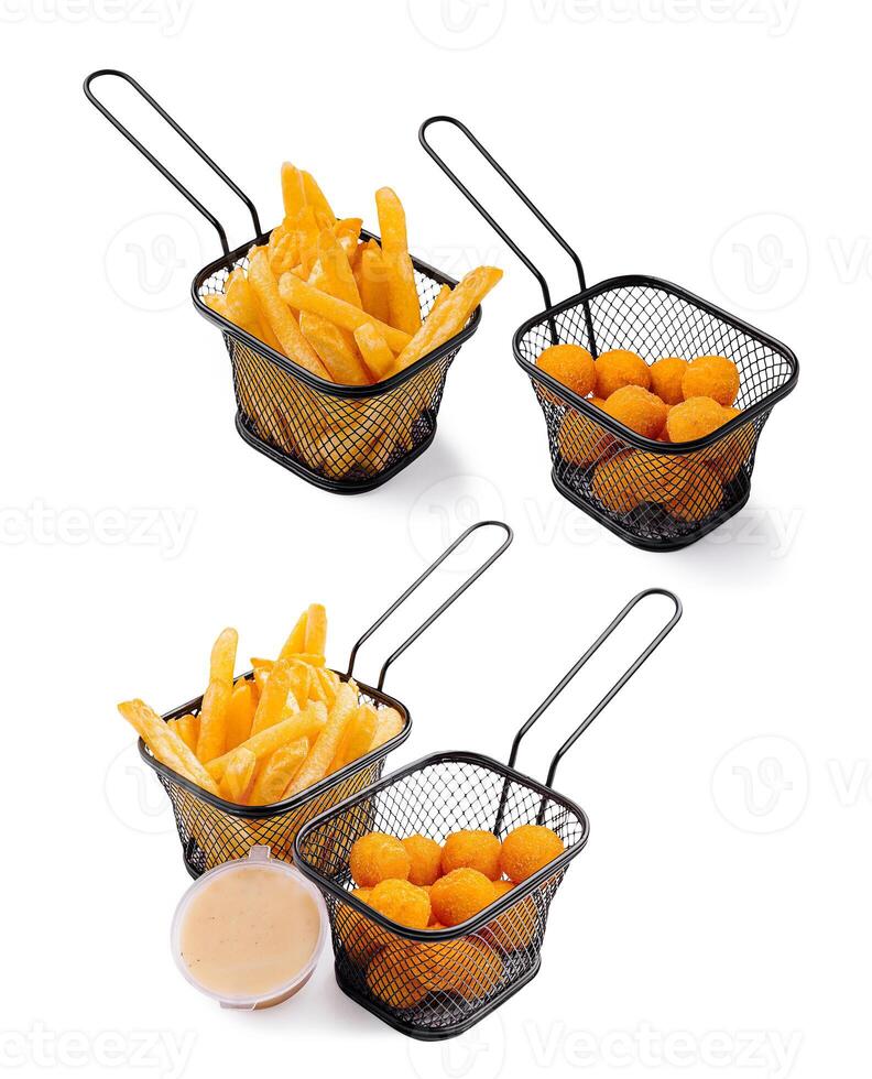 Tasty appetizers served in baskets with dipping sauce photo