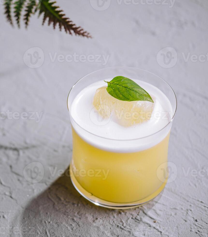 Refreshing lemon cocktail with mint garnish top view photo