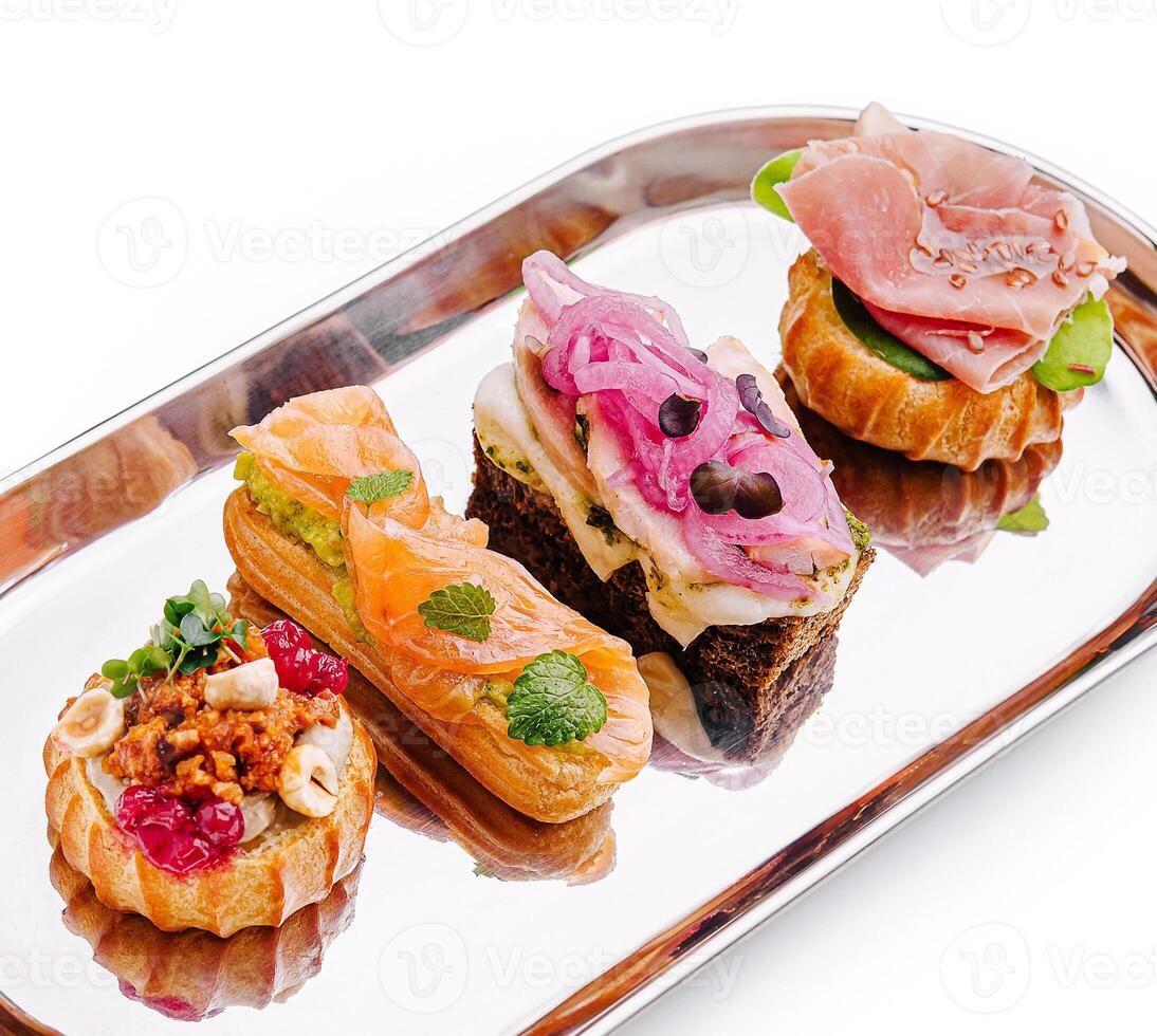 Delightful selection of gourmet canapes on a silver platter photo